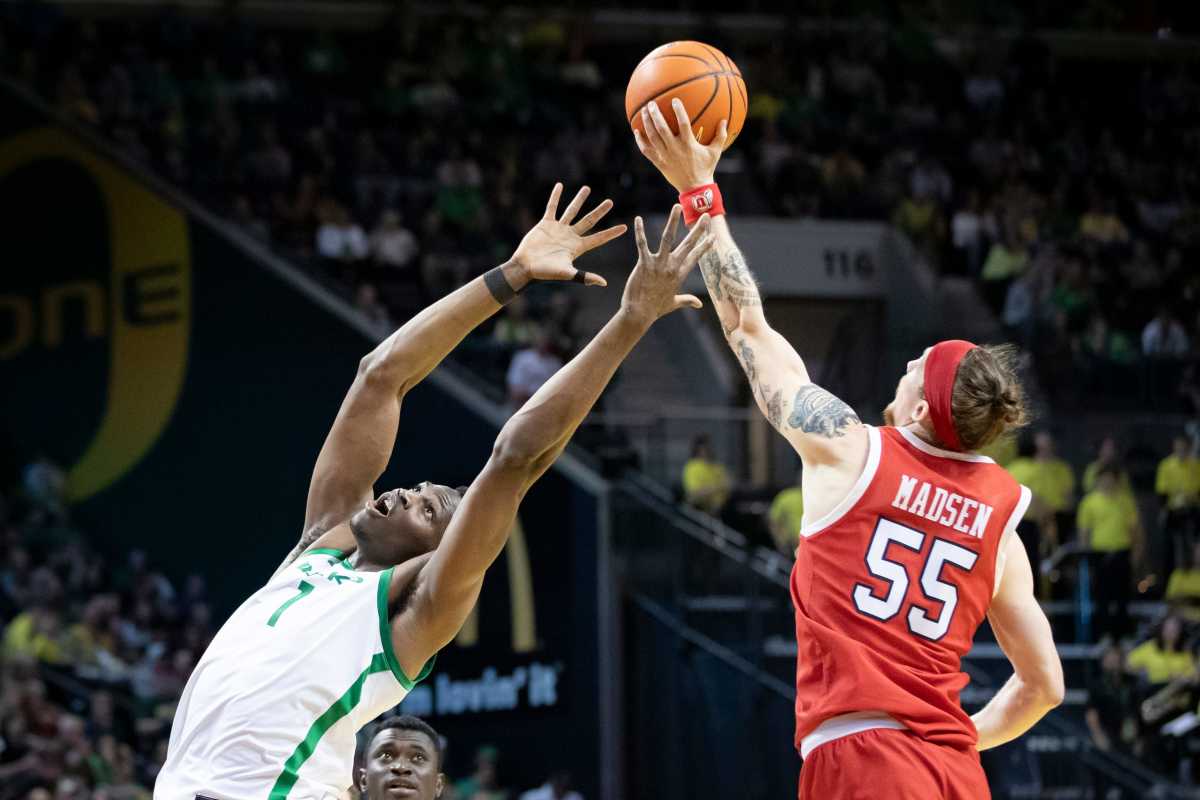 Utah guard Gabe Madsen snags a pass from Oregon center N'Faly Dante as the Oregon Ducks host the Utah Utes Saturday, March 9, 2024 at Matthew Knight Arena in Eugene, Ore.