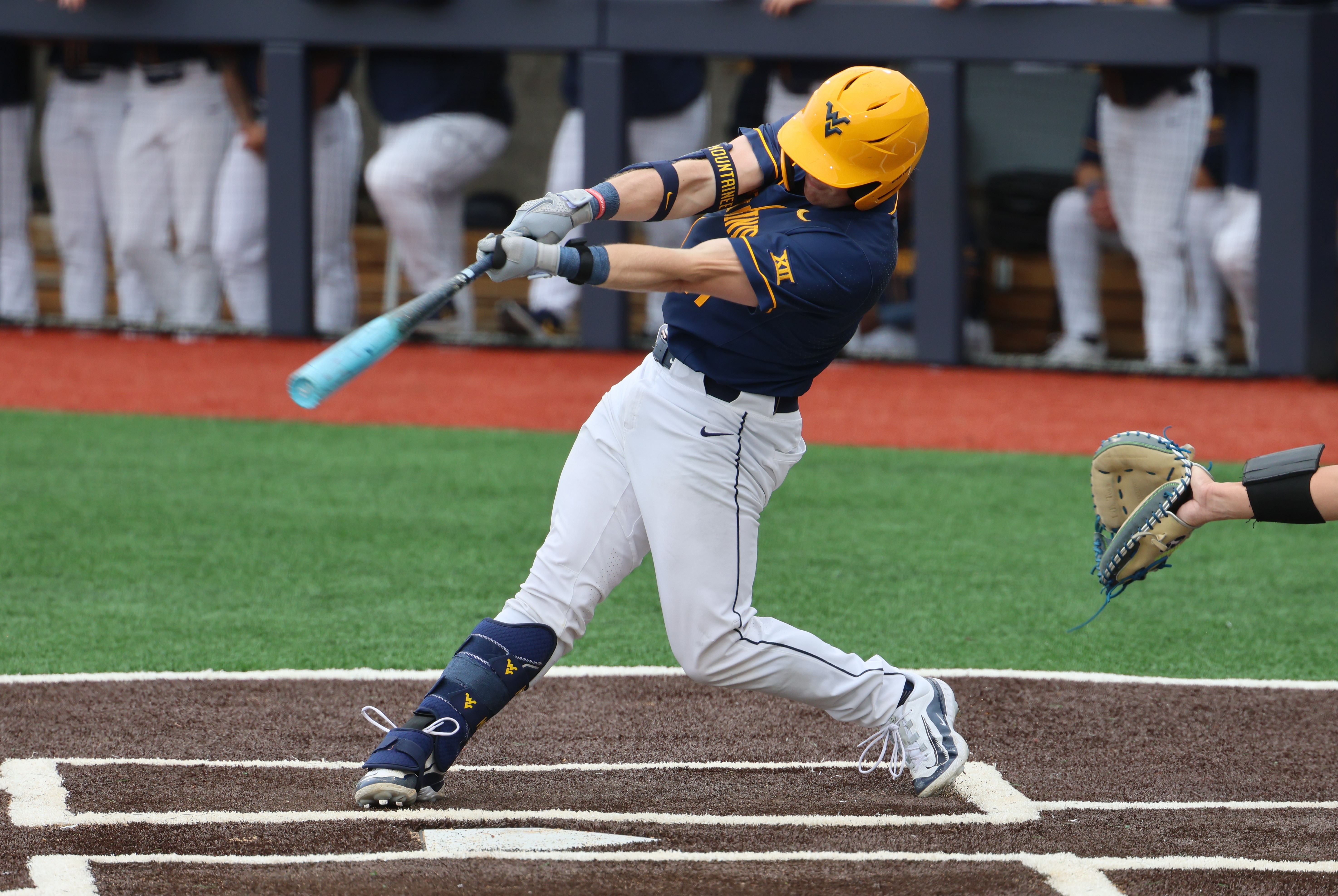 Sophomore Sam White records one of his five hits in the series against BYU.