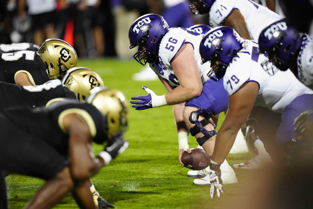 TCU Horned Frogs offensive lineman Alan Ali (56) hikes the ball in the fourth quarter against the Colorado Buffaloes at Folsom Field