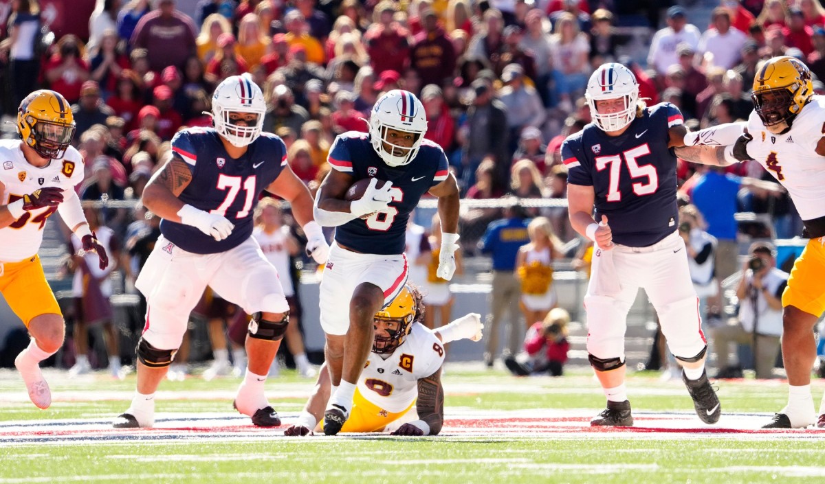 Arizona Wildcats running back Michael Wiley (6) runs for a touchdown against the Arizona State Sun Devils in the first half during the Territorial Cup game at Arizona Stadium in Tucson on Nov. 25, 2022.