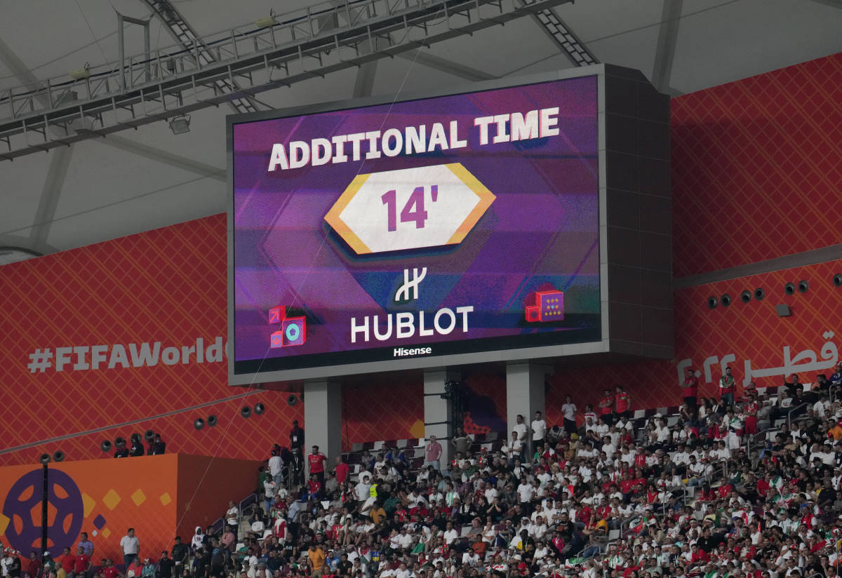 A big screen pictured at a stadium in Qatar signaling 14 minutes of added time during a game at the 2022 FIFA World Cup