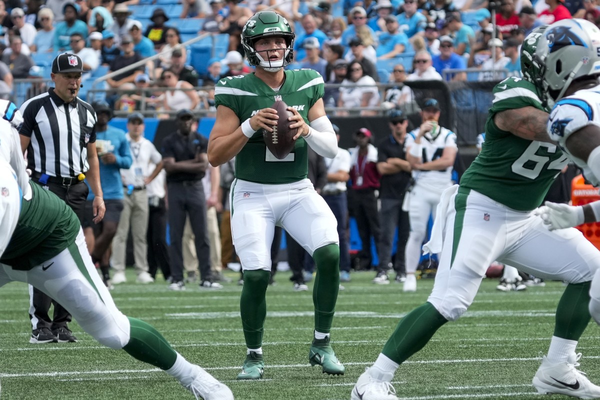 Jets' QB Zach Wilson drops back to pass against Carolina in the NFL Preseason