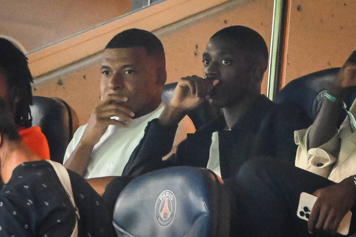 Kylian Mbappe (left) and Ousmane Dembele pictured in the stands during PSG's 0-0 draw against Lorient in August 2023