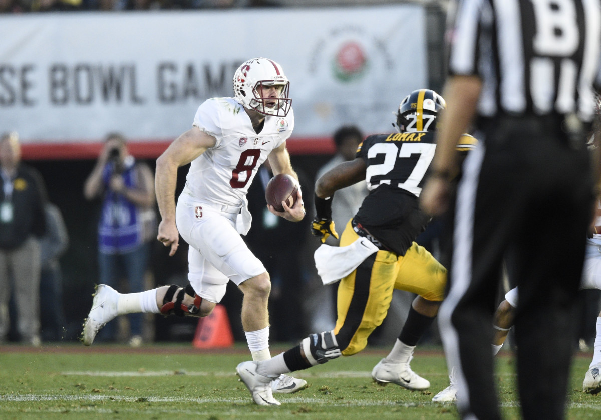 Jan 1, 2016; Pasadena, CA, USA; Stanford Cardinal quarterback Kevin Hogan  (8) runs against the Iowa Hawkeyes during the fourth quarter in the 2016  Rose Bowl at Rose Bowl. Mandatory Credit: Richard …