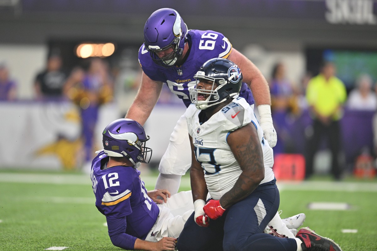 Tennessee Titans defensive tackle Teair Tart (93) reacts after knocking down Minnesota Vikings quarterback Nick Mullens (12) as Minnesota Vikings center Alan Ali (66) looks on during the first quarter at U.S. Bank Stadium.