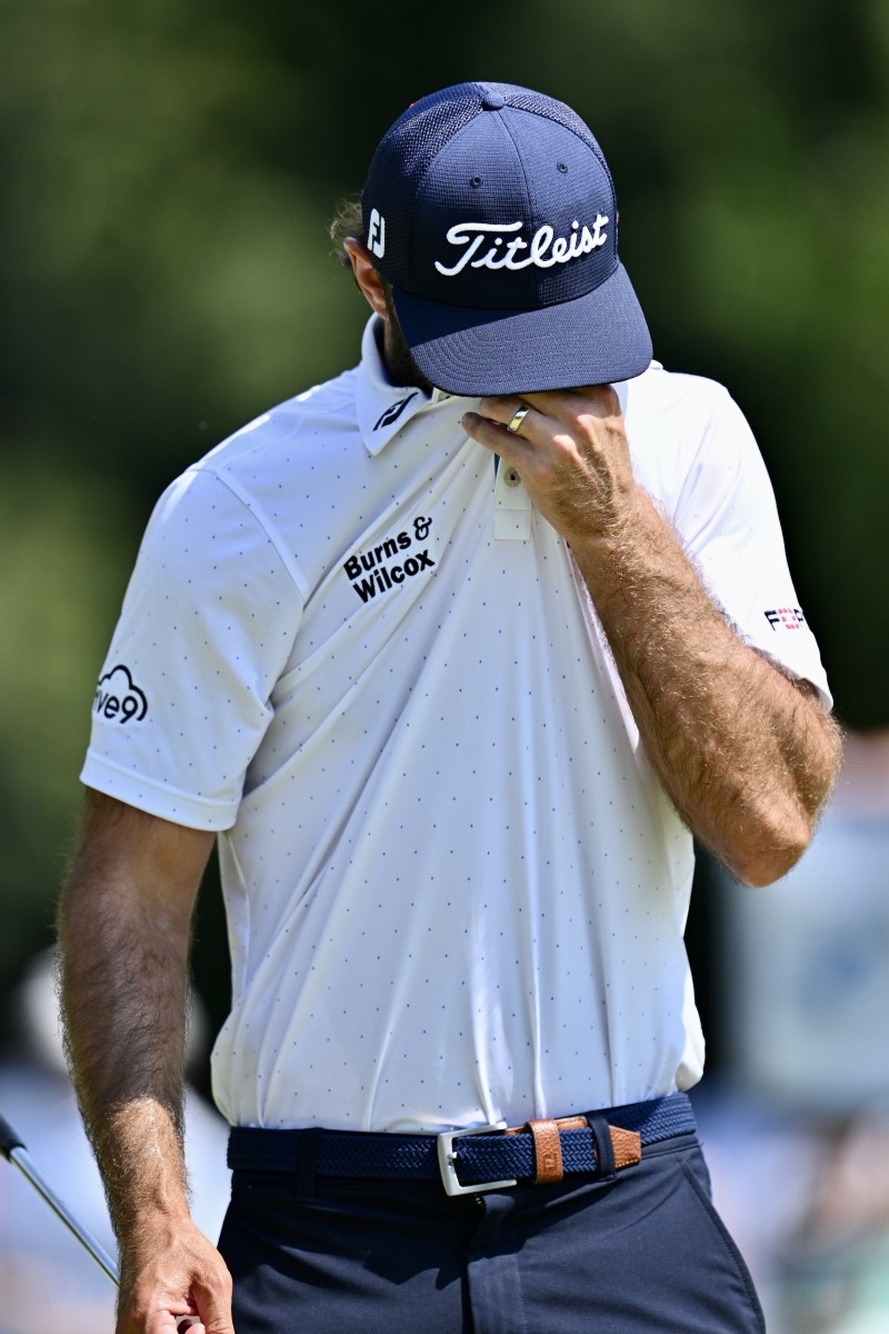 Max Homa wipes his brow after a birdie on No. 5