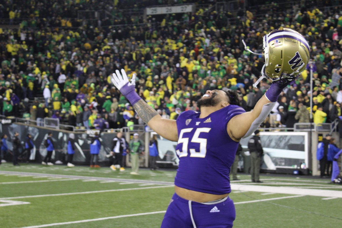 Washington left tackle Troy Fautanu celebrates after beating Oregon.