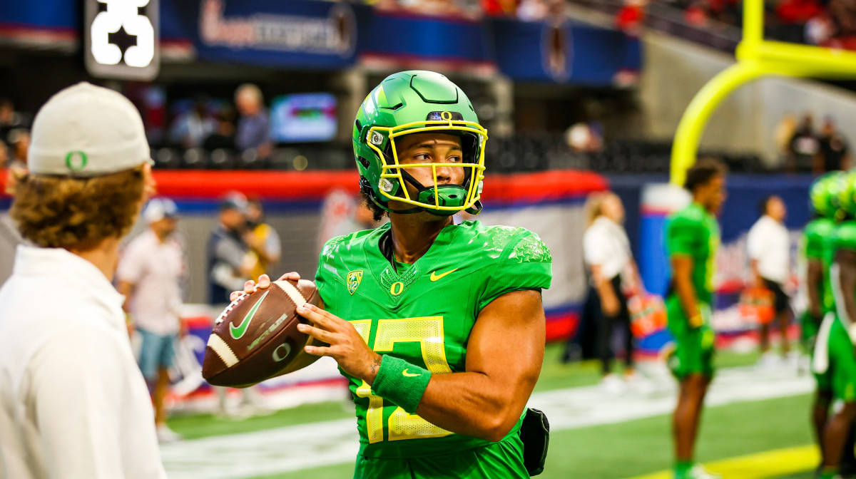 Oregon Ducks quarterback Ty Thompson throws a warm up pass before the Georgia game in 2021.