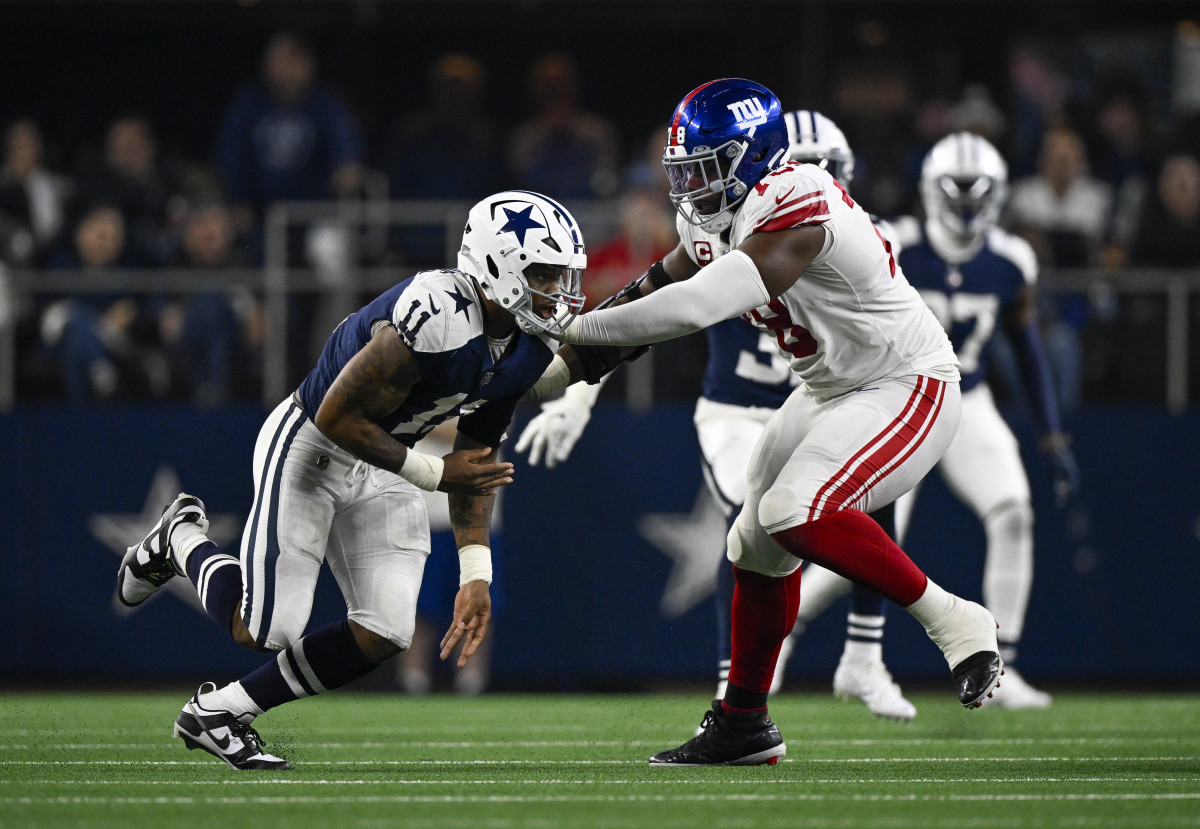 New York Giants offensive tackle Andrew Thomas puts his hands out to try to block Dallas Cowboys linebacker Micah Parsons