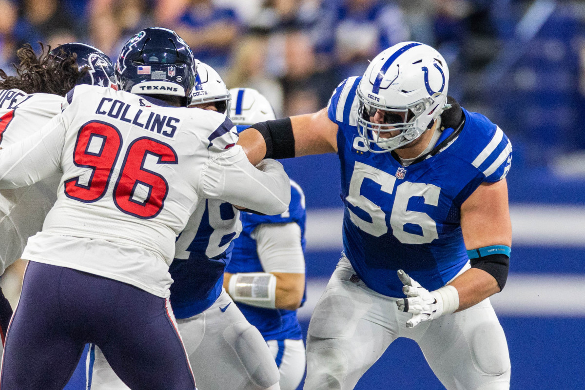Quenton Nelson puts his arm out trying to block a Texans player