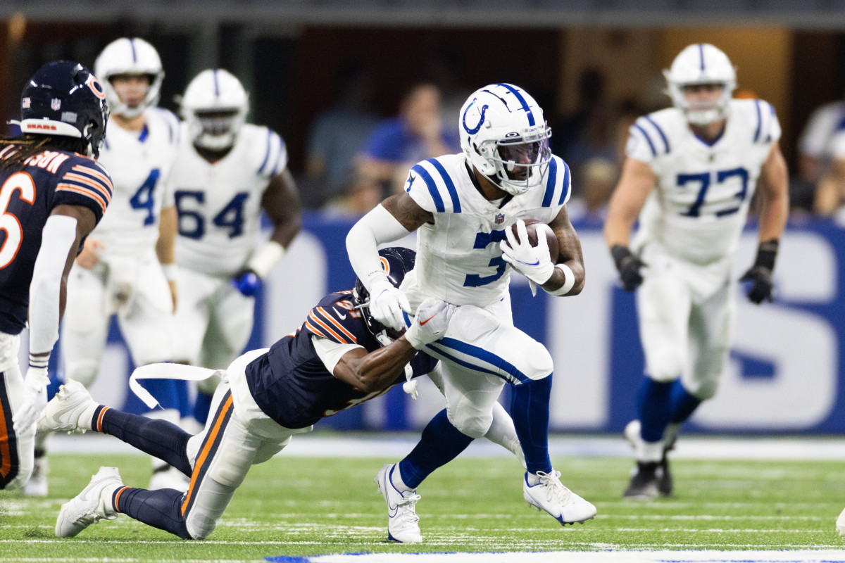 Indianapolis Colts wide receiver Josh Downs (1) is tackled by Chicago Bears  safety A.J. Thomas (38) during the first half of an NFL preseason football  game in Indianapolis, Saturday, Aug. 19, 2023. (