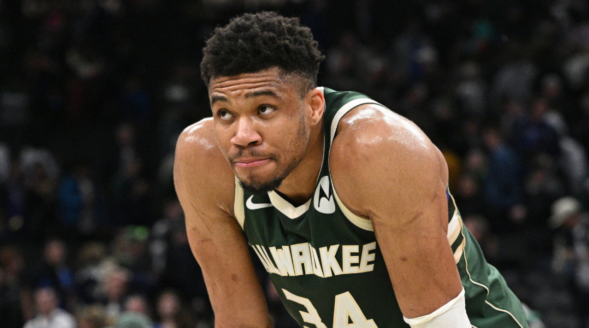 Bucks forward Giannis Antetokounmpo stands on the court during a game.