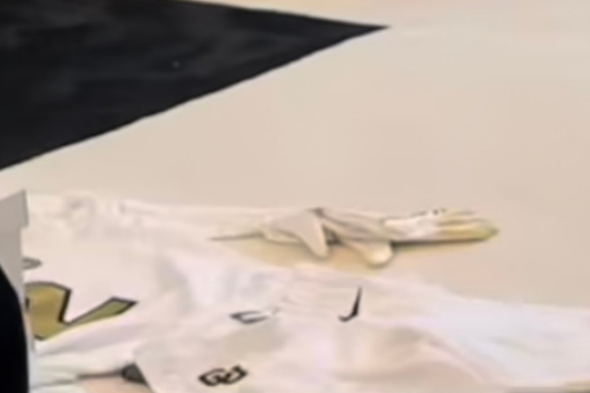 Colorado all-white uniform on the floor of Coach Prime's office