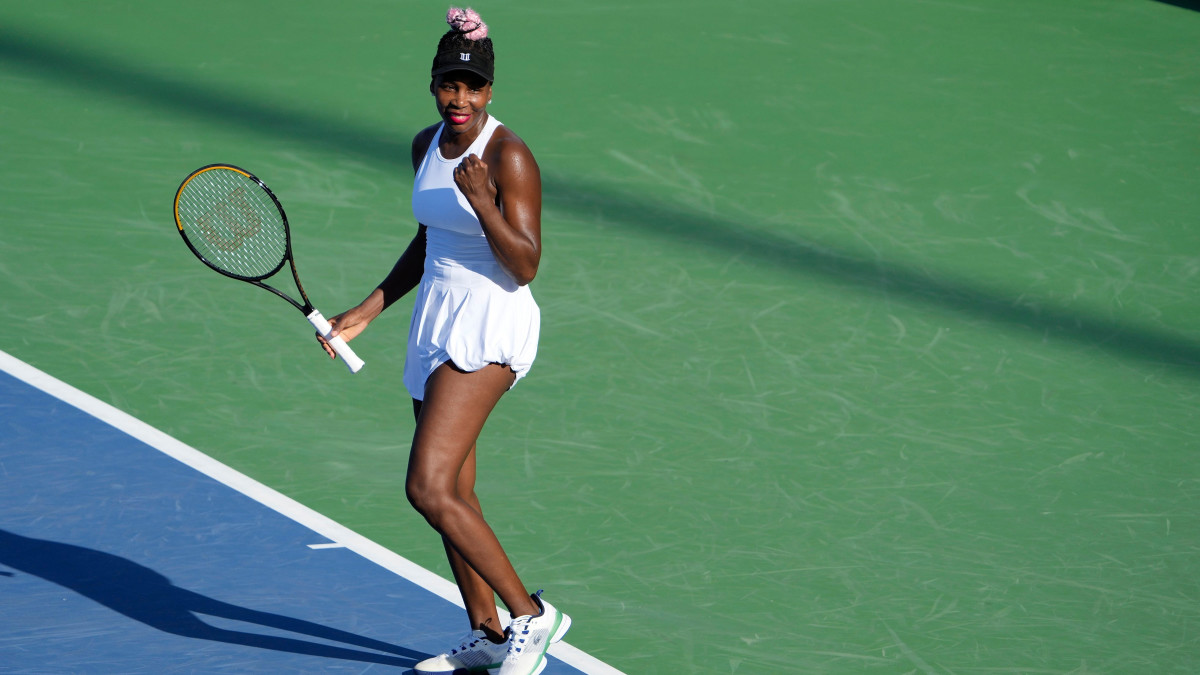 Venus Williams celebrates after beating Veronika Kudermetova during Round 1 of the Western & Southern Open.