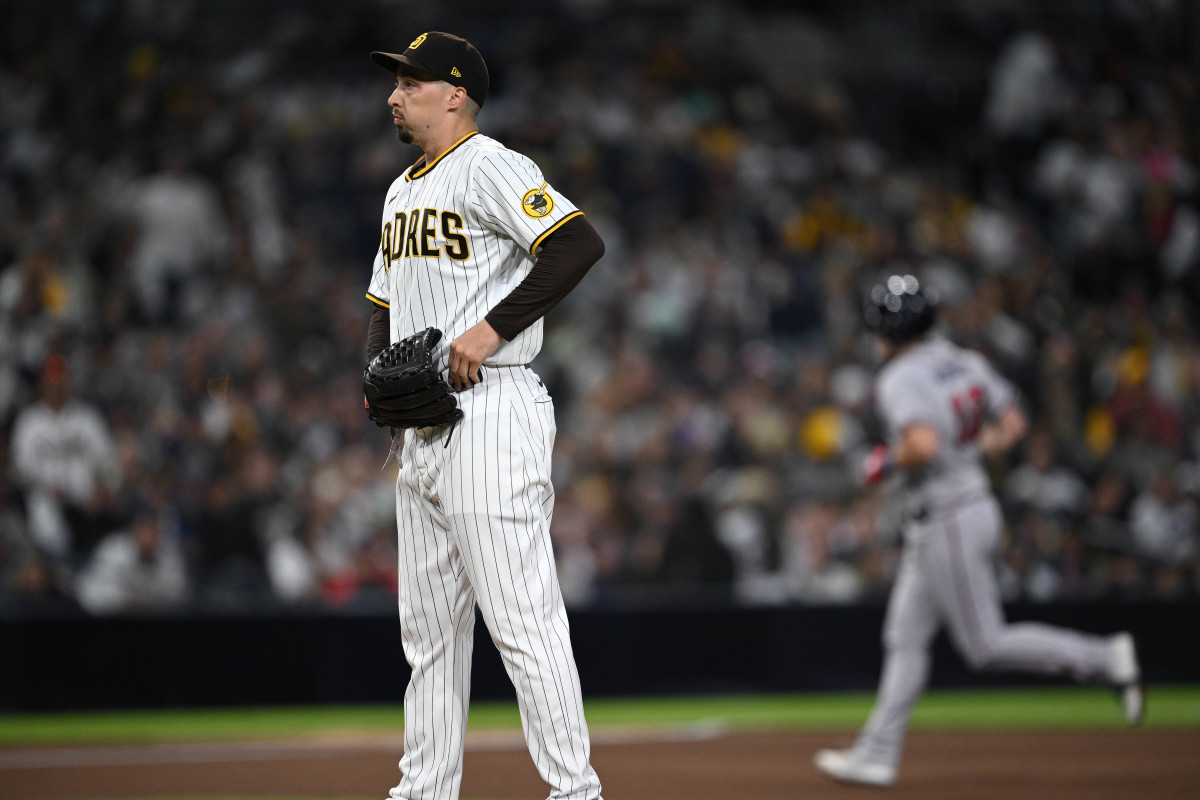 Apr 18, 2023; San Diego, California, USA; San Diego Padres starting pitcher Blake Snell (left) looks on as Atlanta Braves catcher Sean Murphy (12) rounds the bases after hitting a home run during the fourth inning at Petco Park.