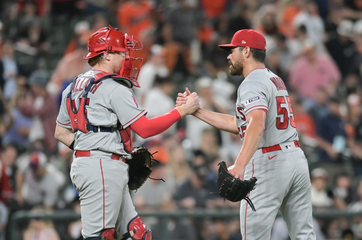 Angels left-handed pitcher Matt Moore (55) celebrates with catcher Chad Wallach (35) after recording the final out against the Baltimore Orioles at Camden Yards.