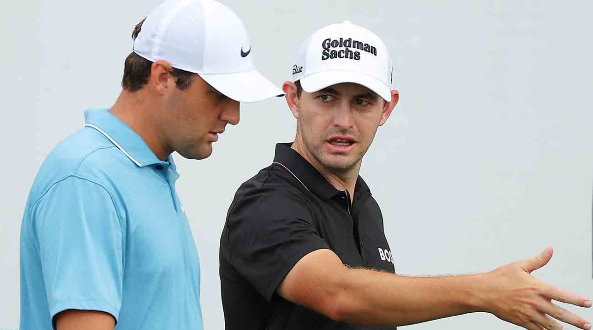 Patrick Cantlay talks to Scottie Scheffler during the first round of the 2022 Tour Championship.