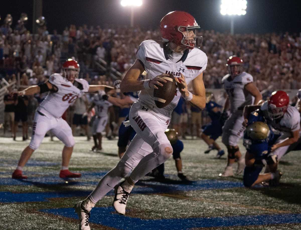 2025 5-star QB George MacIntyre rolling right during a high school game on August 26th, 2023, in Nashville, Tennessee. (Photo by Denny Simmons of The Tennessean)