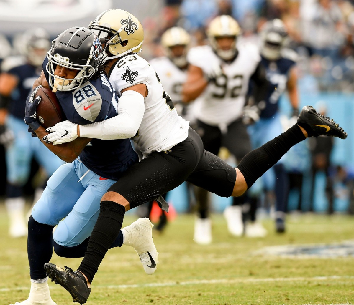 Nov. 14, 2021; Tennessee Titans wide receiver Marcus Johnson (88) is tackled by New Orleans Saints cornerback Marshon Lattimore (23).© George Walker IV / Tennessean.com / USA TODAY NETWORK 