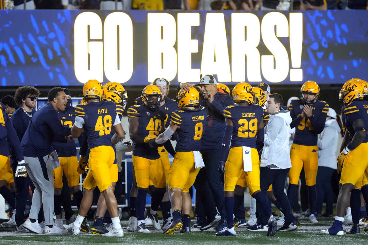 Nov 19, 2022; Berkeley, California, USA; California Golden Bears linebacker Jackson Sirmon (8) is congratulated by teammates and staff after scoring a touchdown against the Stanford Cardinal during the fourth quarter at FTX Field at California Memorial Stadium. Mandatory Credit: Darren Yamashita-USA TODAY Sports