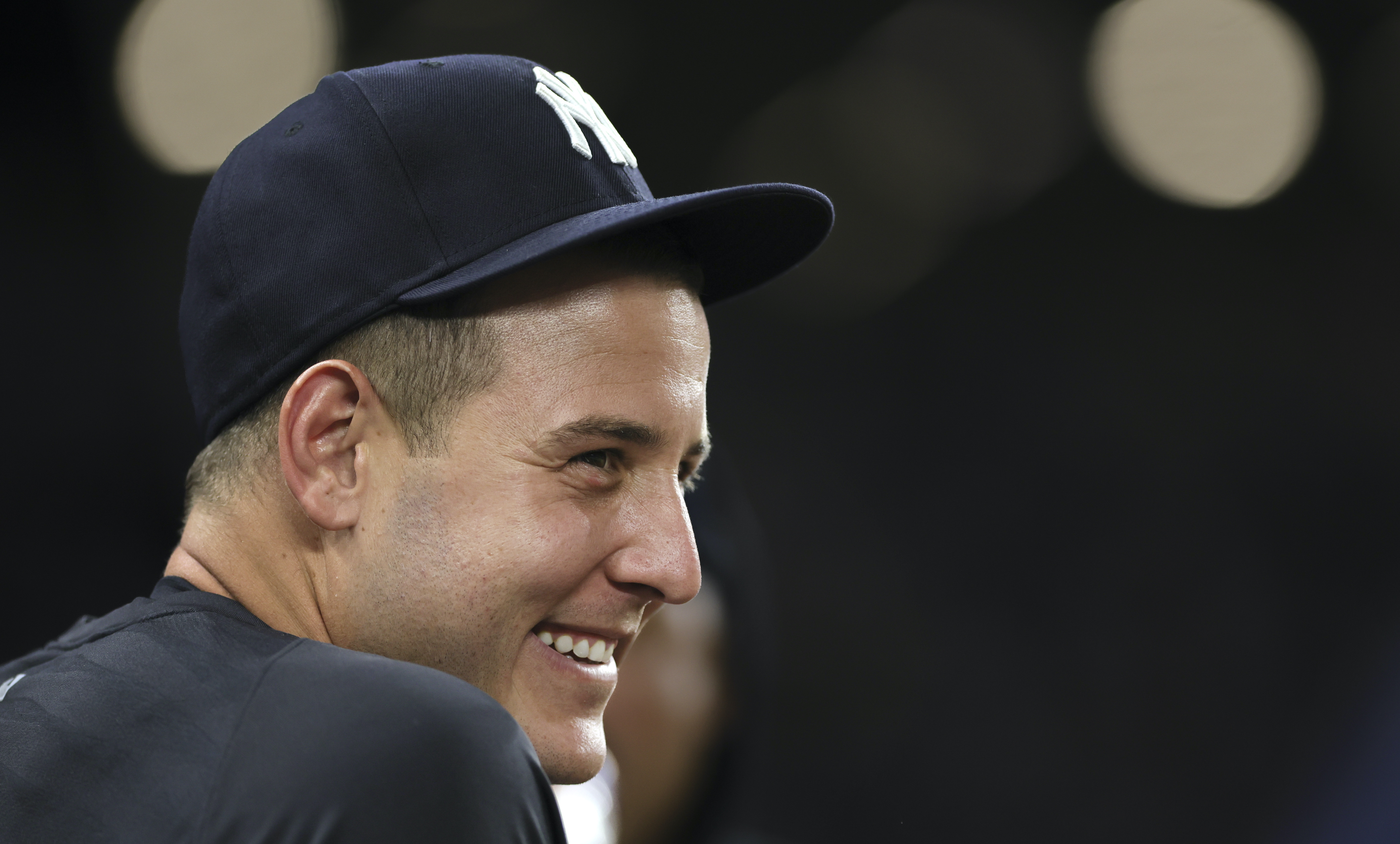 New York Yankees first baseman Anthony Rizzo looks on in an NYPD hat  against the New York Mets during the seventh inning of a baseball game on  Saturday, Sept. 11, 2021, in