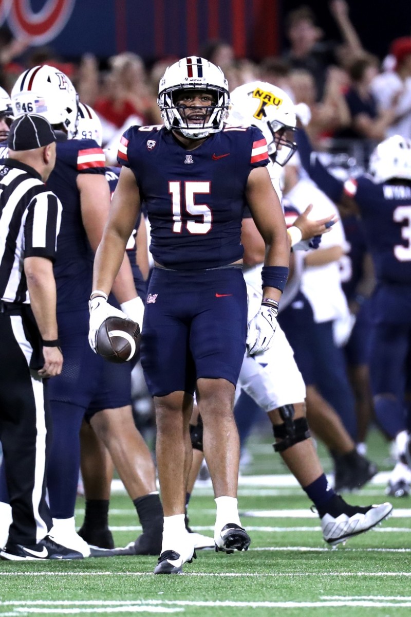 Former Husky linebacker Daniel Heimuli was a season-opening starter for Arizona.