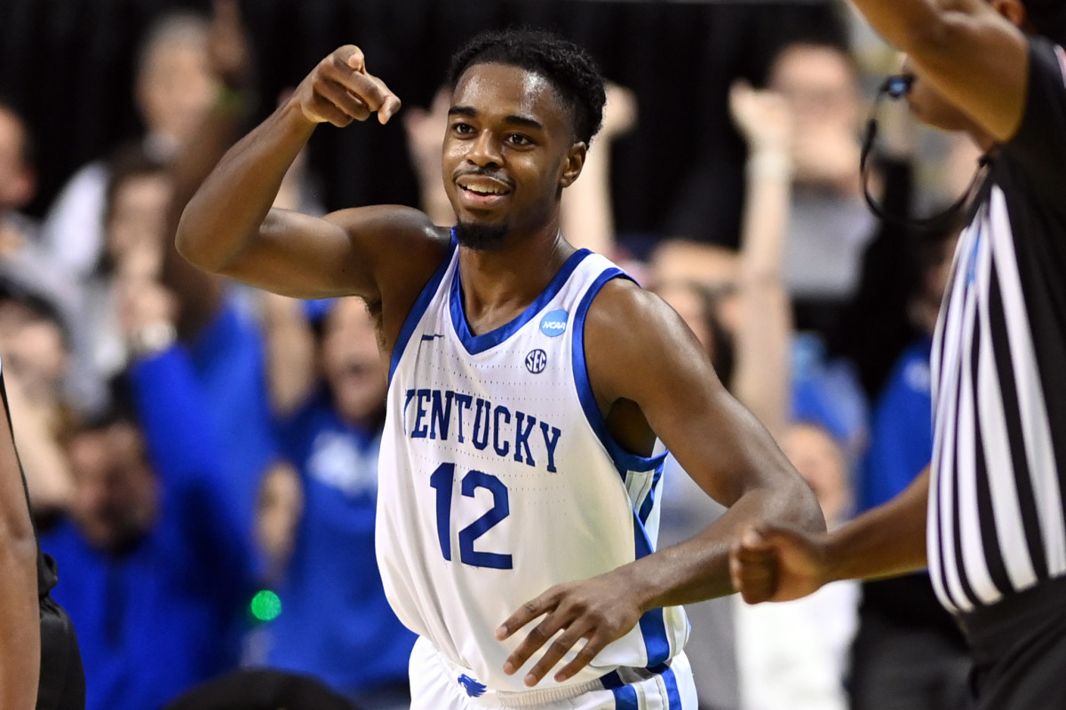 Mar 17, 2023; Greensboro, NC, USA; Kentucky Wildcats guard Antonio Reeves (12) celebrates in the first half against the Providence Friars at Greensboro Coliseum. Mandatory Credit: Bob Donnan-USA TODAY Sports  