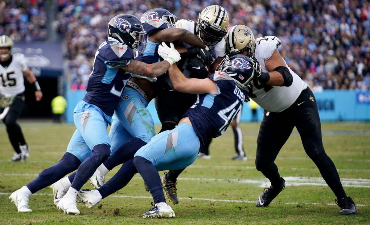 Nov. 14, 2021; The Titans defense stops New Orleans Saints running back Mark Ingram (14). © Andrew Nelles / Tennessean.com / USA TODAY NETWORK