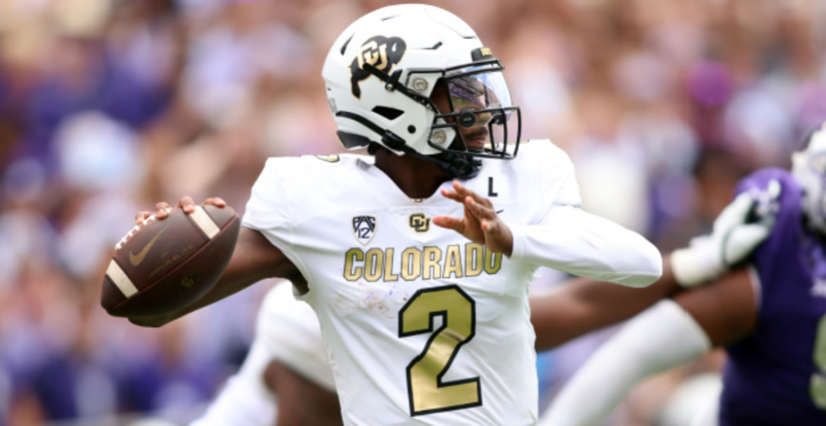 Colorado Buffaloes quarterback Shedeur Sanders attempts a pass during a college football game.