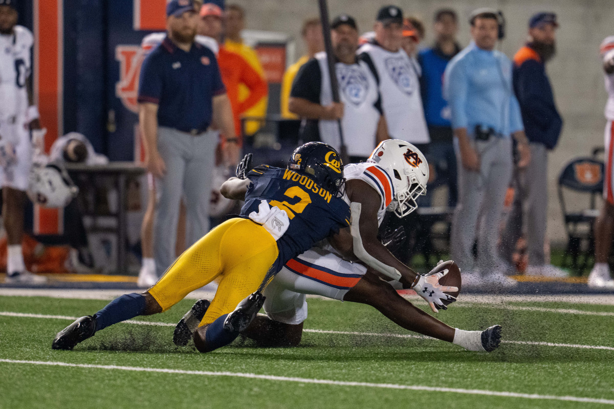 Sep 9, 2023; Berkeley, California, USA; Auburn Tigers tight end Rivaldo Fairweather (13) makes a catch for a first down against California Golden Bears defensive back Craig Woodson (2) during the fourth quarter at California Memorial Stadium. Mandatory Credit: Neville E. Guard-USA TODAY Sports