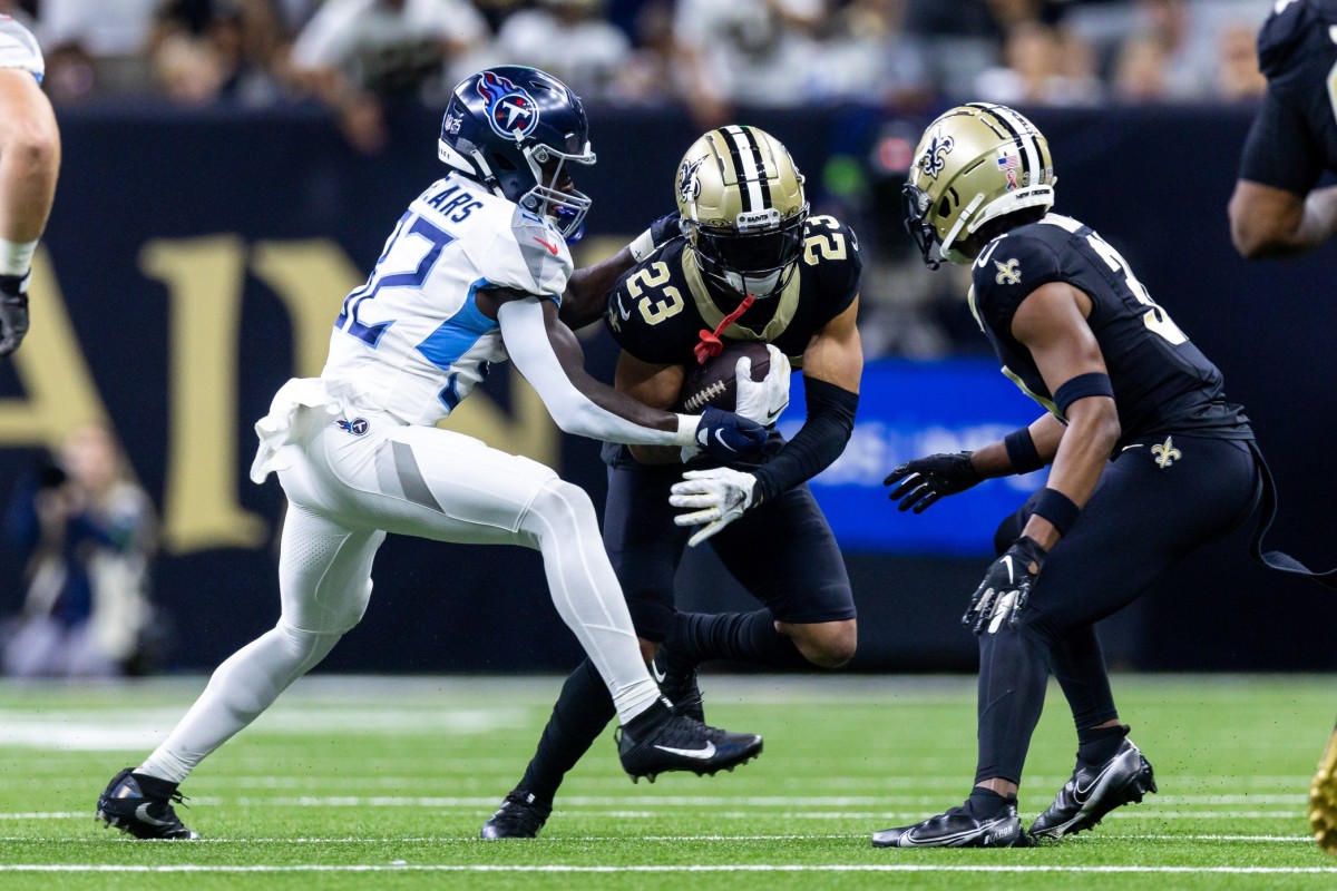 New Orleans Saints cornerback Marshon Lattimore (23) intercepts a pass against the Tennessee Titans. Mandatory Credit: Stephen Lew-USA TODAY Sports