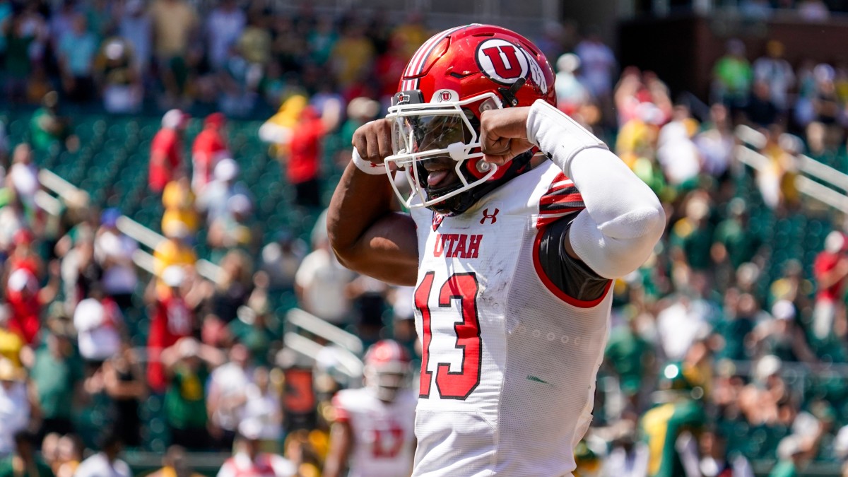 Utah freshman quarterback Nate Johnson celebrates after scoring against Baylor.