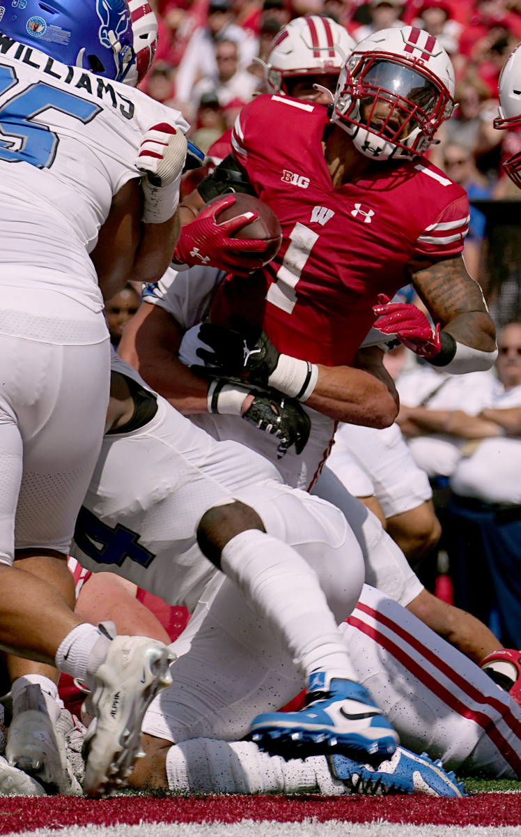 Sep 2, 2023; Madison, WI, USA; Wisconsin Badgers running back Chez Mellusi (1) scores a touchdown against the Buffalo Bulls during the first quarter at Camp Randall Stadium. Mandatory Credit: Mark Hoffman-USA TODAY Sports