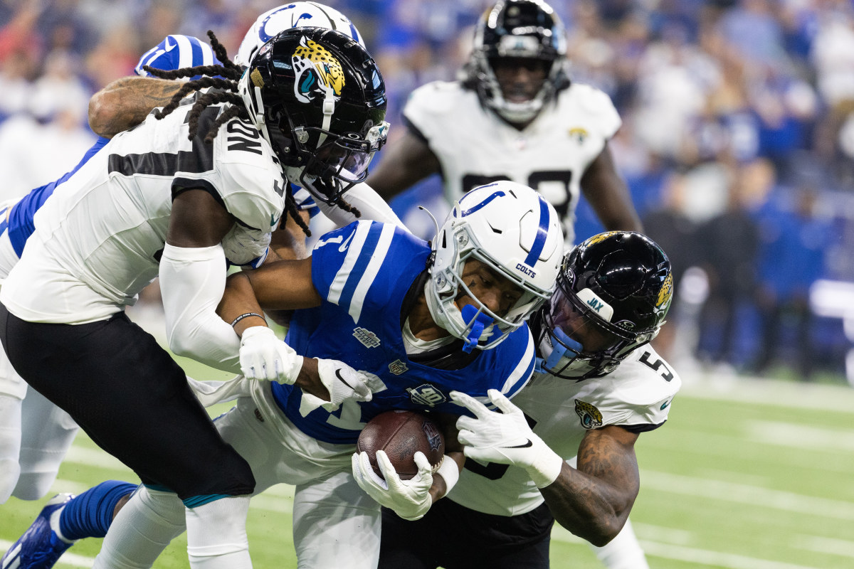 Sep 10, 2023; Indianapolis, Indiana, USA; Indianapolis Colts wide receiver Josh Downs (1) catches the ball while Jacksonville Jaguars safety Andre Cisco (5) defends in the first quarter at Lucas Oil Stadium. Mandatory Credit: Trevor Ruszkowski-USA TODAY Sports