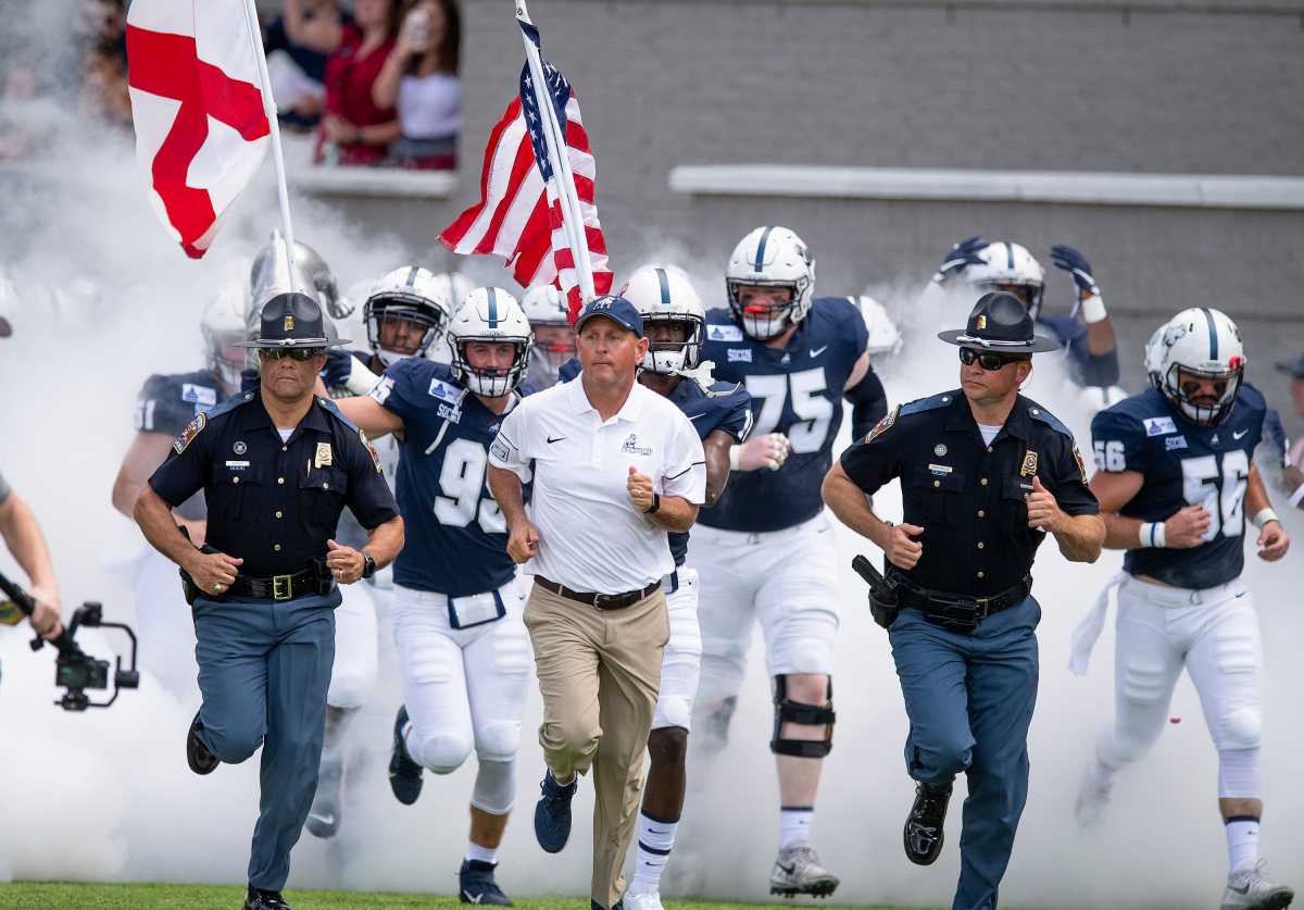 Samford head coach Chris Hatcher takes the field with his team before the Guardian Credit Union FCS Kickoff at Cramton Bowl in Montgomery, Ala., on Friday August 23, 2019. Fcs23  