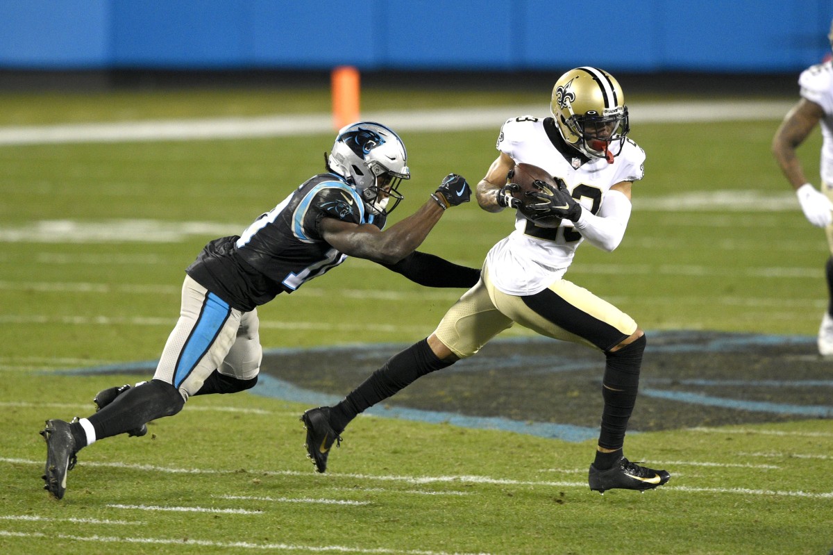 Jan 3, 2021; New Orleans Saints cornerback Marshon Lattimore (23) intercepts a pass intended for Carolina Panthers wide receiver Curtis Samuel (10). Mandatory Credit: Bob Donnan-USA TODAY Sports