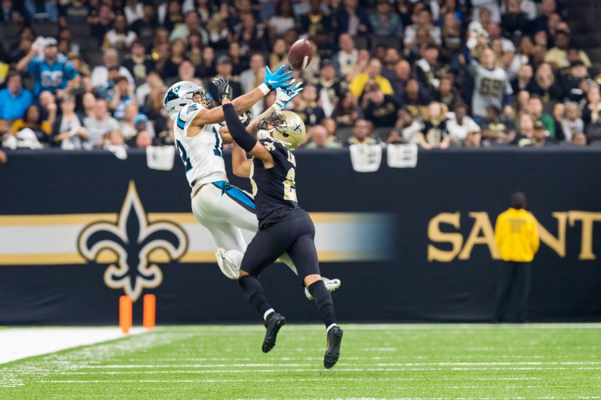 Dec. 18, 2018; Saints cornerback Marshon Lattimore breaks up a pass to Panthers receiver DJ Moore. © SCOTT CLAUSE/USA TODAY Network