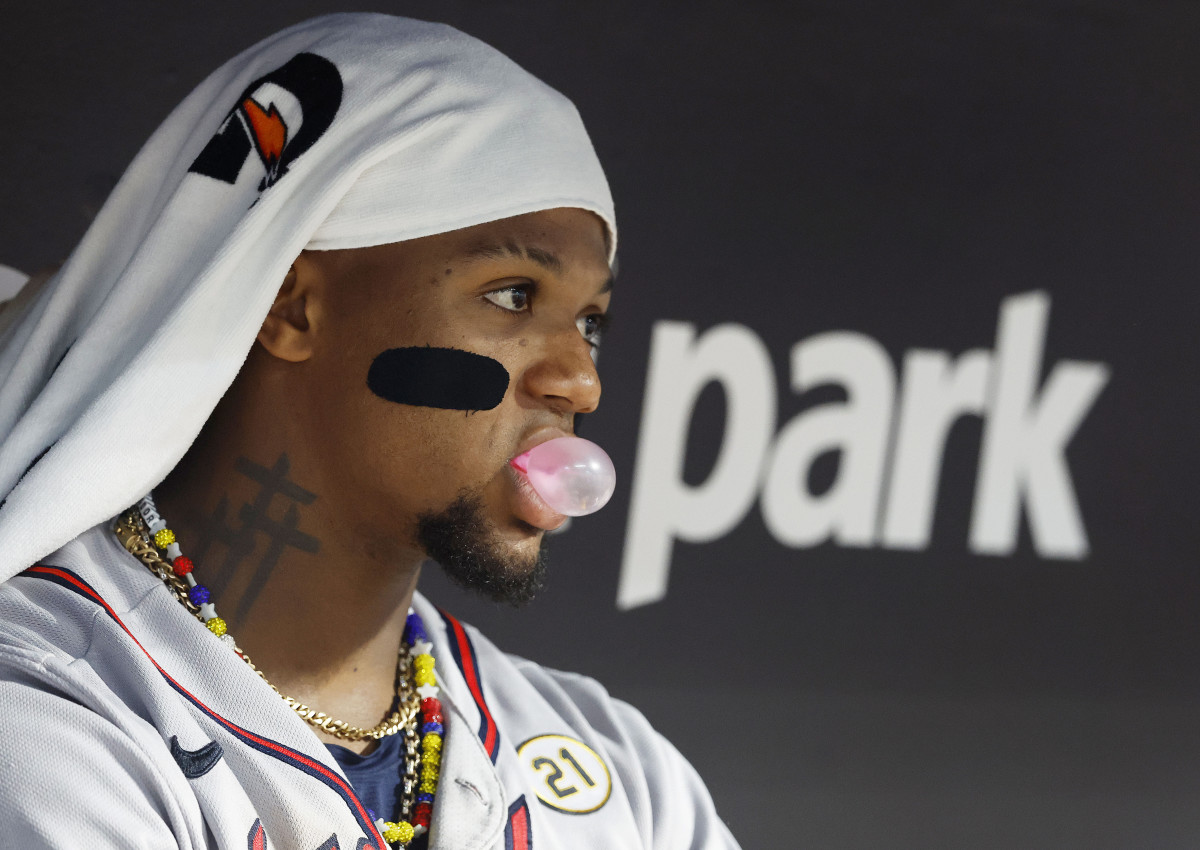 Sep 15, 2023; Miami, Florida, USA; Atlanta Braves right fielder Ronald Acuna Jr.(13) blows a bubblegum in the dugout during the fifth inning at loanDepot Park.