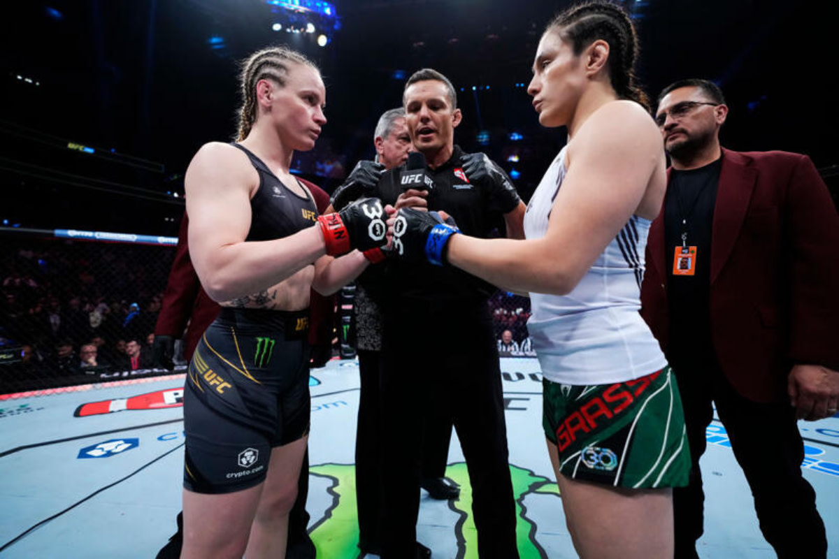 Valentina Shevchenko and Alexa Grasso touch gloves before their UFC Women's Flyweight Championship fight.