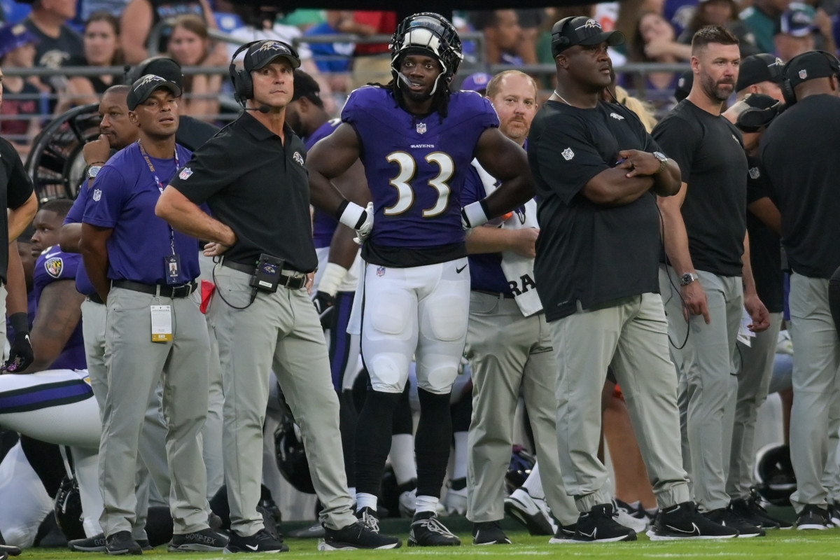 Ravens sign three players to practice squad, release one