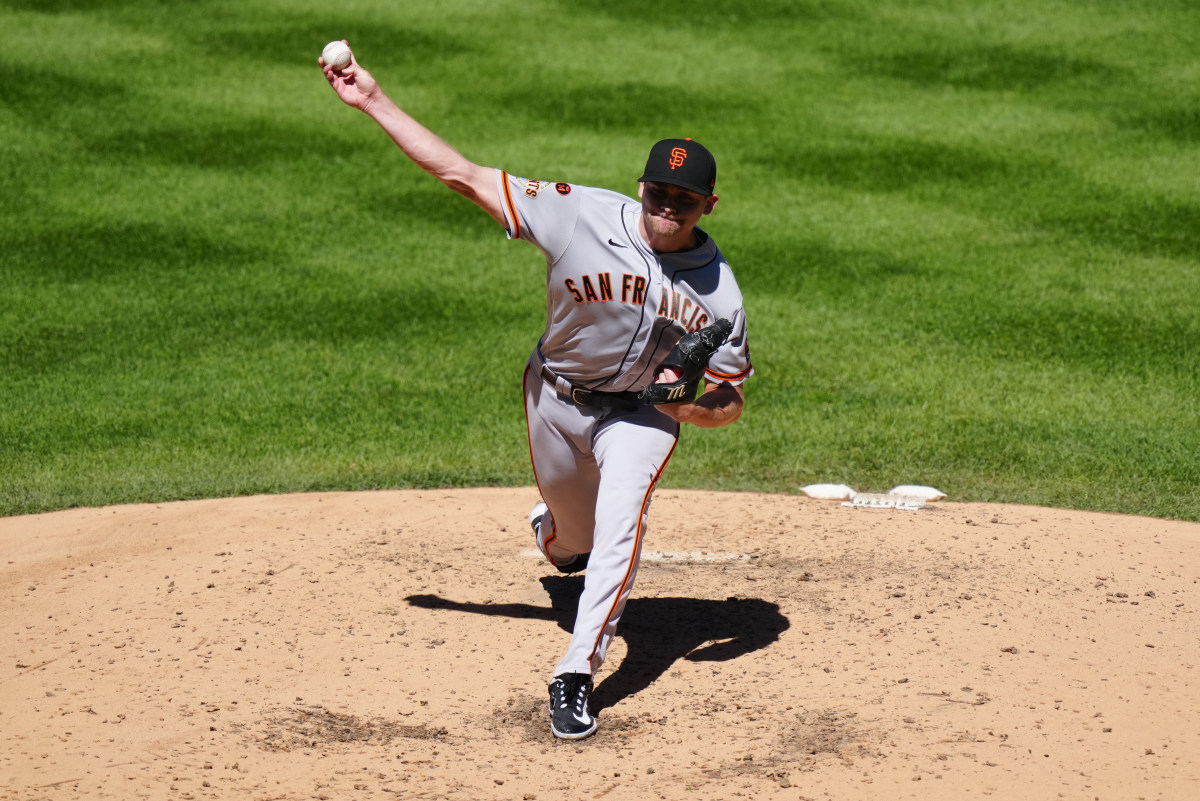 SF Giants starting pitcher Keaton Winn pitches against the Colorado Rockies in the first inning at Coors Field on September 16, 2023.