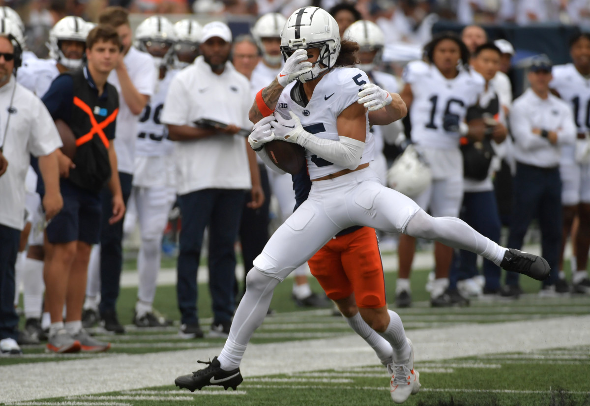 Penn State cornerback Cam Miller intercepts a pass in front of Illinois receiver Casey Washington in the Nittany Lions' 30-13 victory.