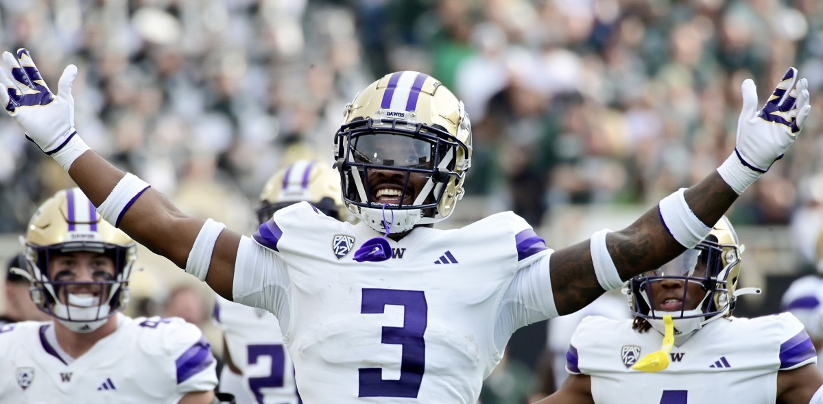 Mishael Powell celebrates his first career interception, in the first quarter at Michigan State.