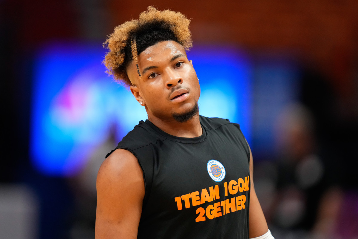 Miles McBride warms up for the New York Knicks in a playoff game against the Miami Heat.