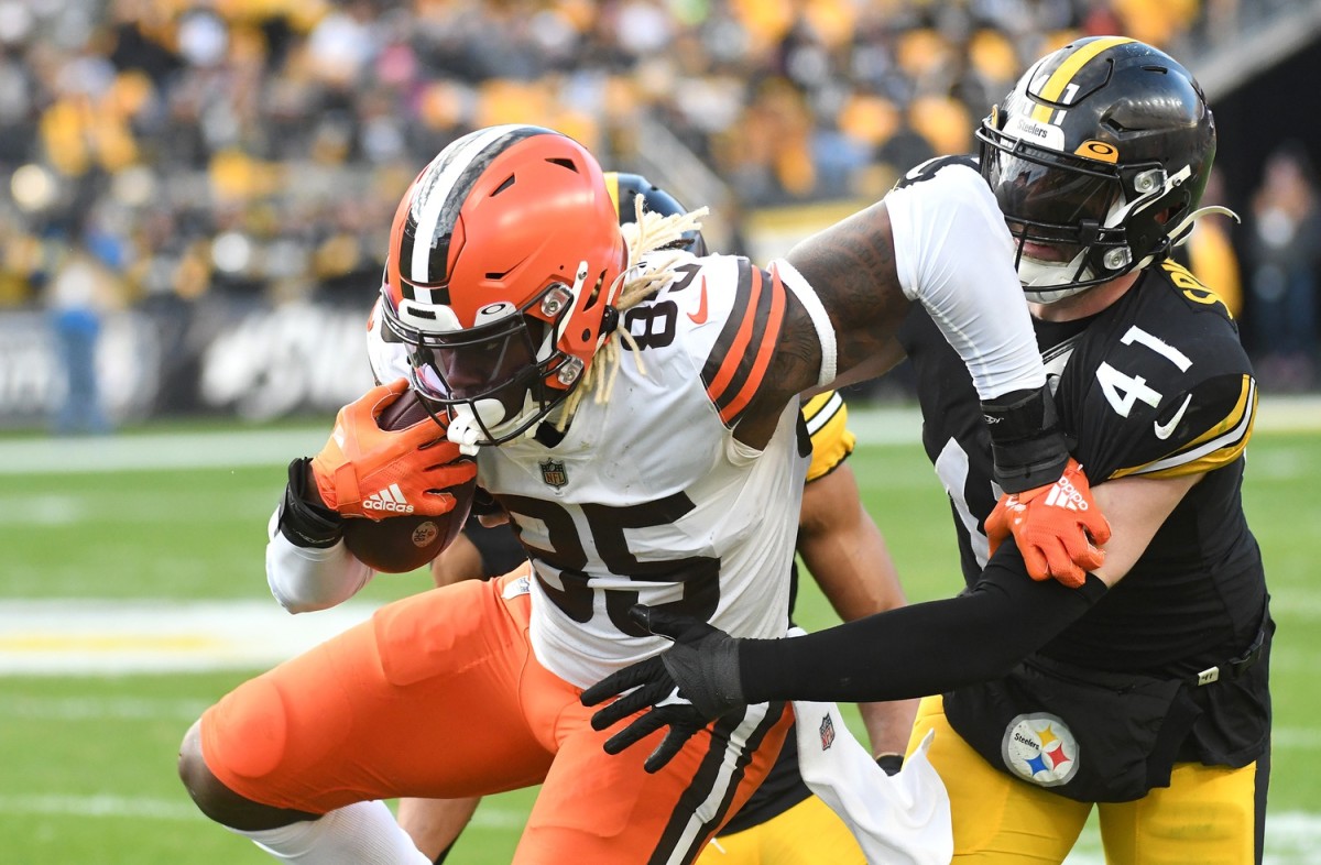 Jan 8, 2023; Pittsburgh, Pennsylvania, USA; Cleveland Browns tight end David Njoku (85) is tackled by Pittsburgh Steelers linebacker Robert Spillane (41) on a seven yard gain during the fourth quarter at Acrisure Stadium. Mandatory Credit: Philip G. Pavely-USA TODAY Sports