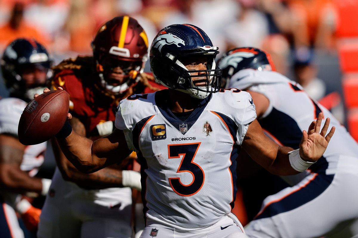 Denver Broncos quarterback Russell Wilson throws the ball against the Washington Commanders.
