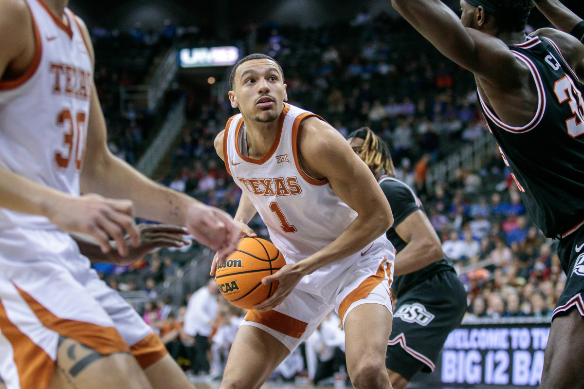 Texas Longhorns forward Dylan Disu (1) looks for an opening during the first half against the Oklahoma State Cowboys at T-Mobile Center.