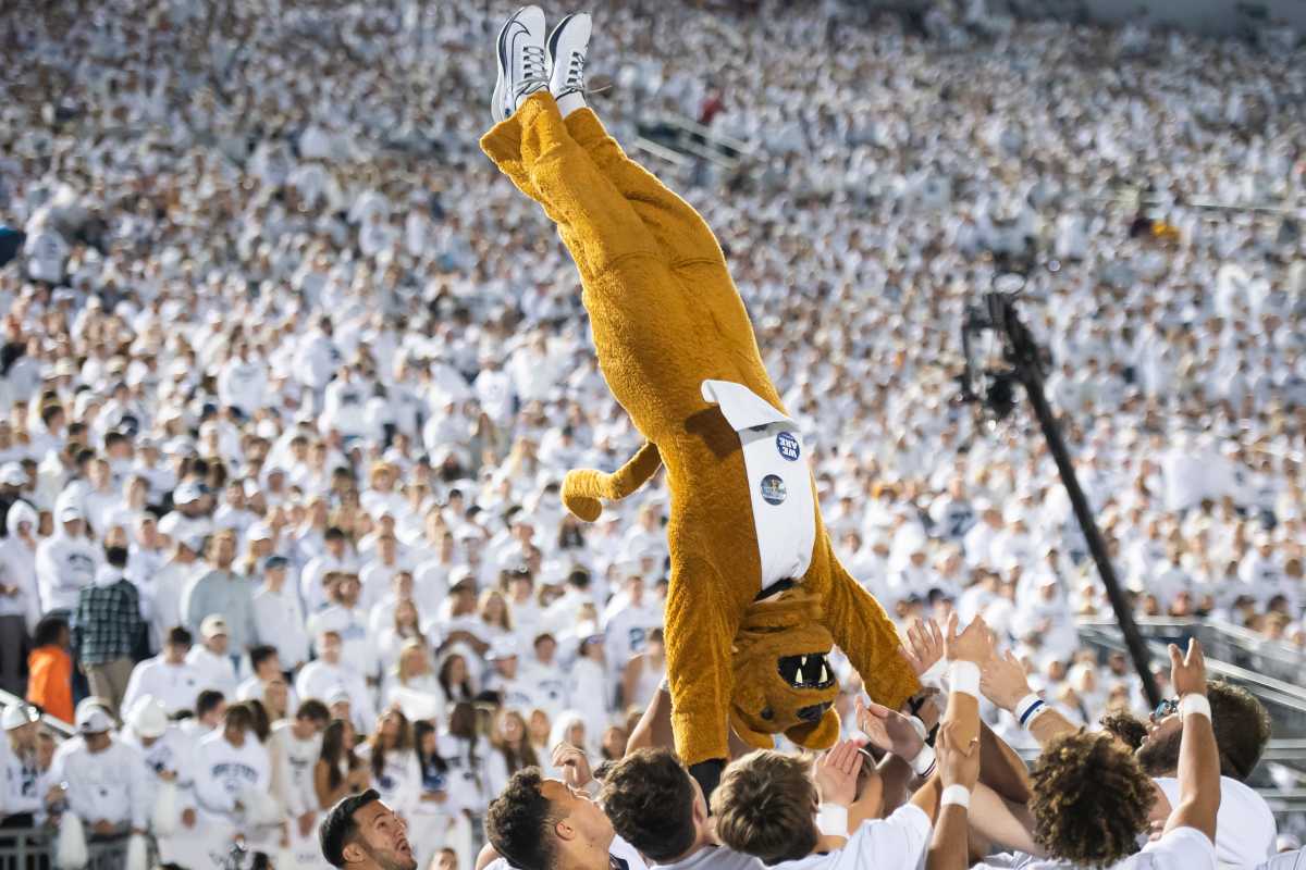 The Penn State Nittany Lion mascot does a flip during the 2023 White Out game against Minnesota at Beaver Stadium.