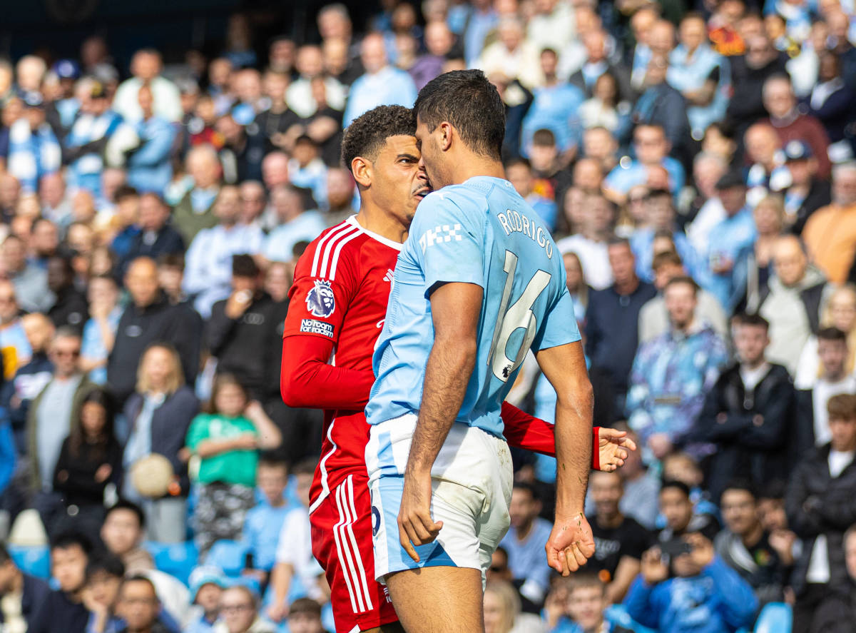 Manchester City midfielder Rodri pictured (right) going head to head with Nottingham Forest's Morgan Gibbs-White during a Premier League game in September 2023