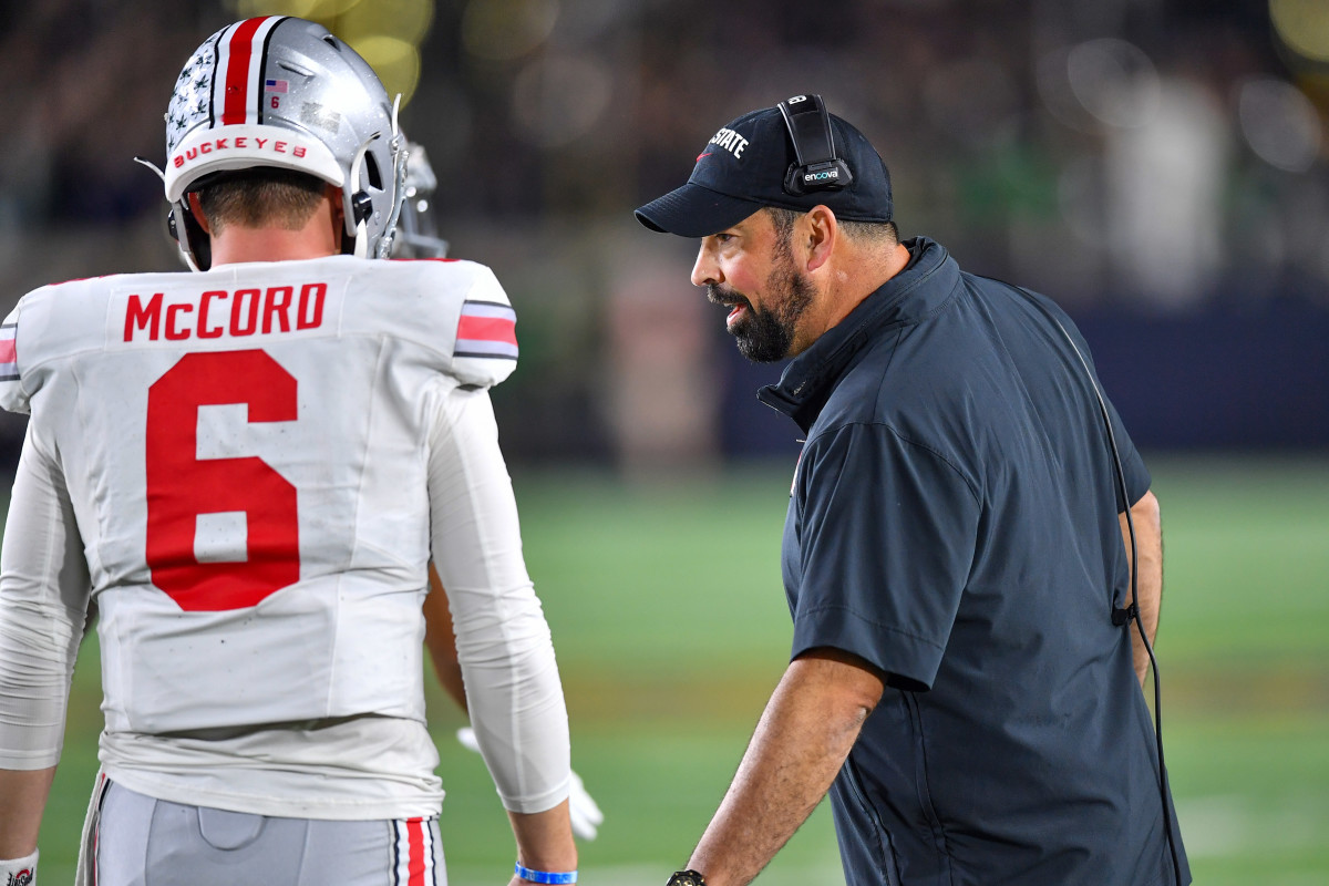 Ohio State Buckeyes head coach Ryan Day talks to quarterback Kyle McCord (6) in the second quarter against the Notre Dame Fighting Irish at Notre Dame Stadium. 